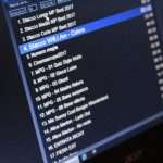 Monitor showing a playlist; track 4 'Stacco Will I Am - Colors' highlighted in blue