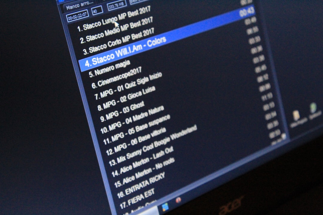 Monitor showing a playlist; track 4 'Stacco Will I Am - Colors' highlighted in blue
