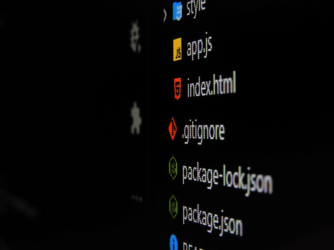 Close-up of a dark screen showing a code/file explorer list with index.html and package.json among others
