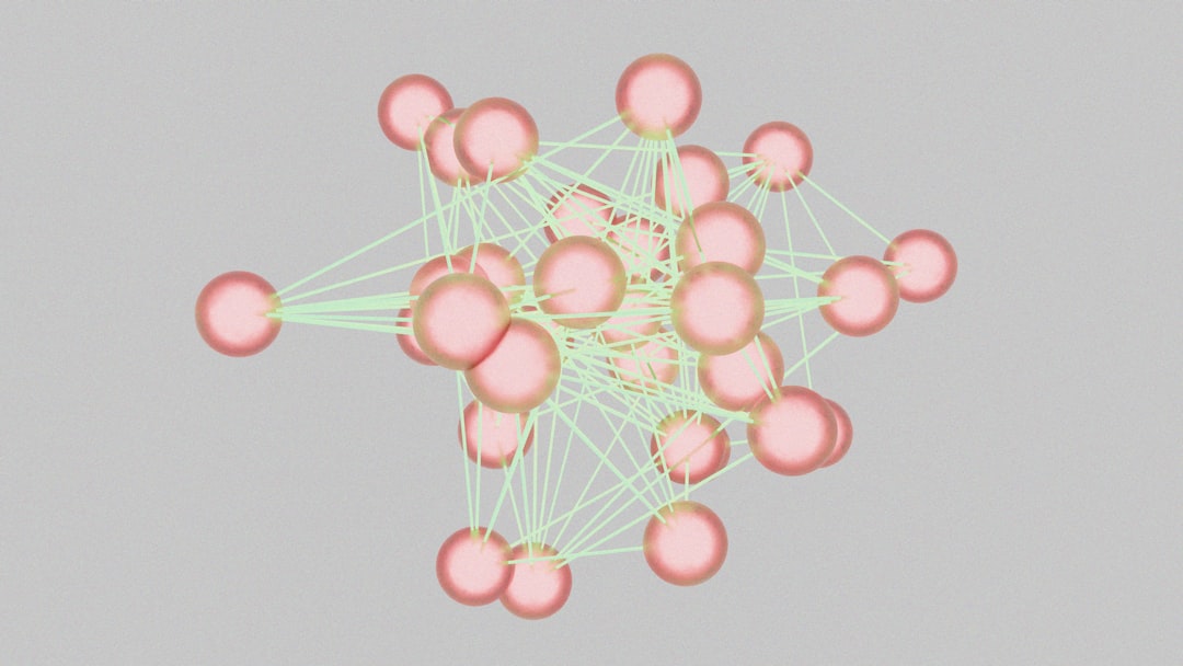 3D render of pink spheres connected by pale green lines, showing a complex network.