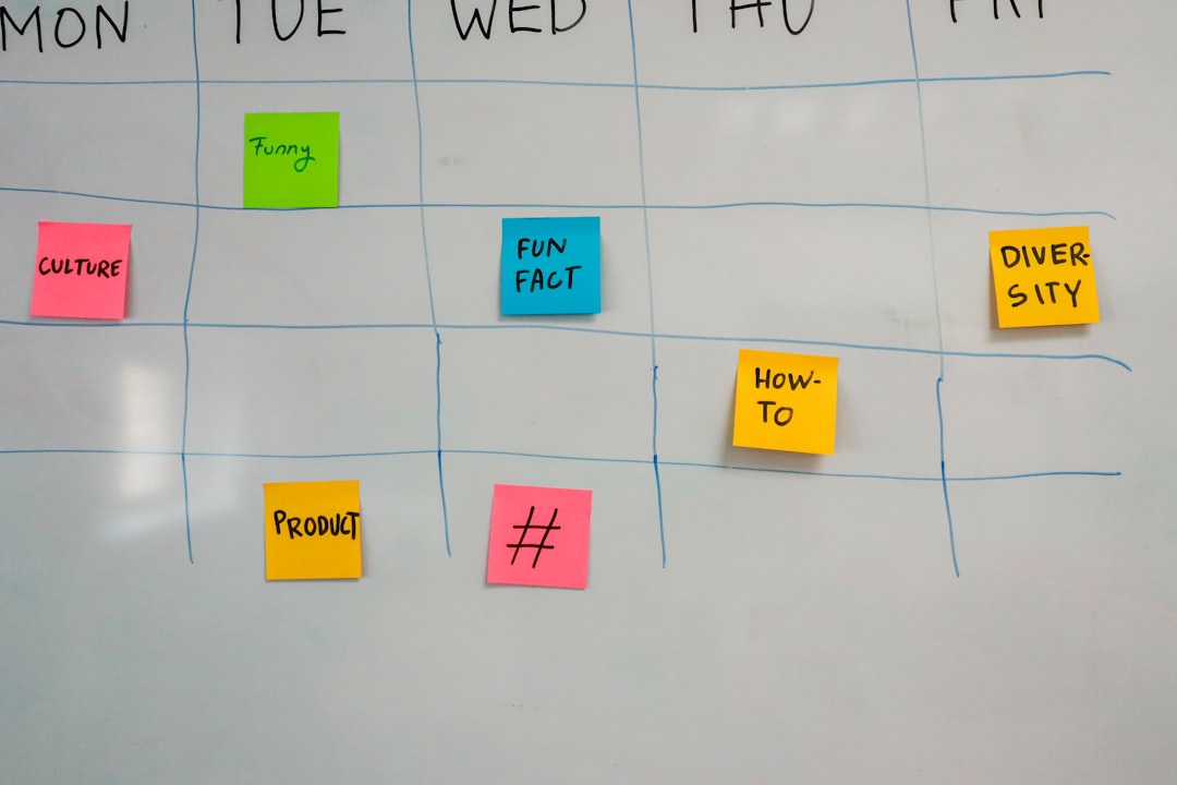 Whiteboard calendar with days Mon–Fri and sticky notes labeled CULTURE, FUNNY, FUN FACT, HOW-TO, DIVERSITY, PRODUCT, and # across the week.