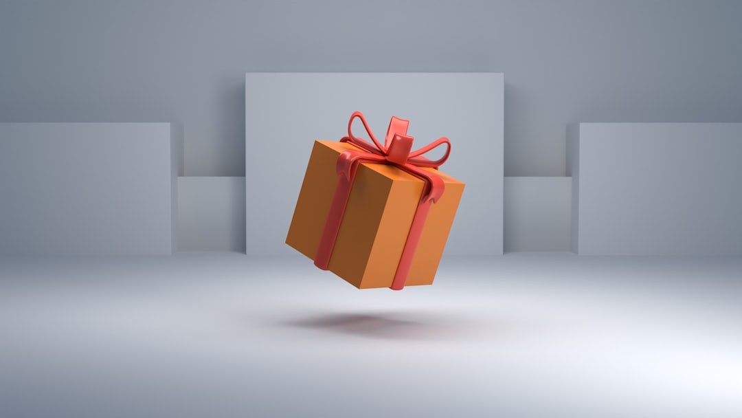 Floating orange gift box with a red ribbon hovering in a minimalist gray set-up.