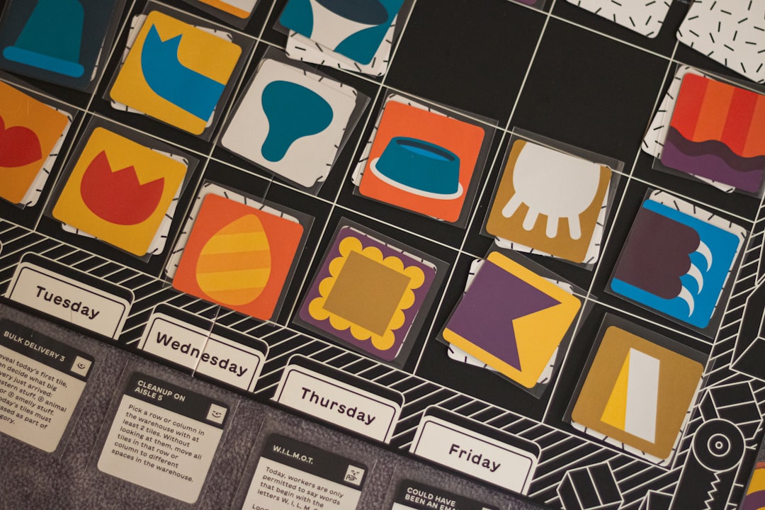Colorful square tiles with abstract icons arranged on a grid above weekday tabs (Tuesday–Friday).