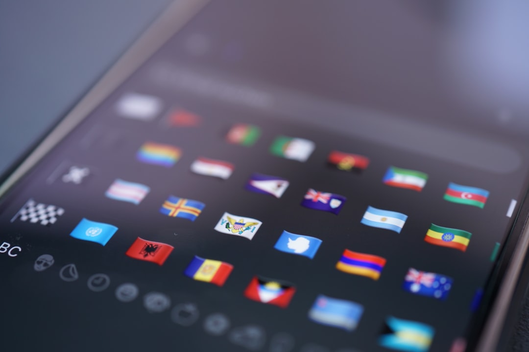 Smartphone screen displaying a grid of small country flag icons, slightly blurred at the edges.