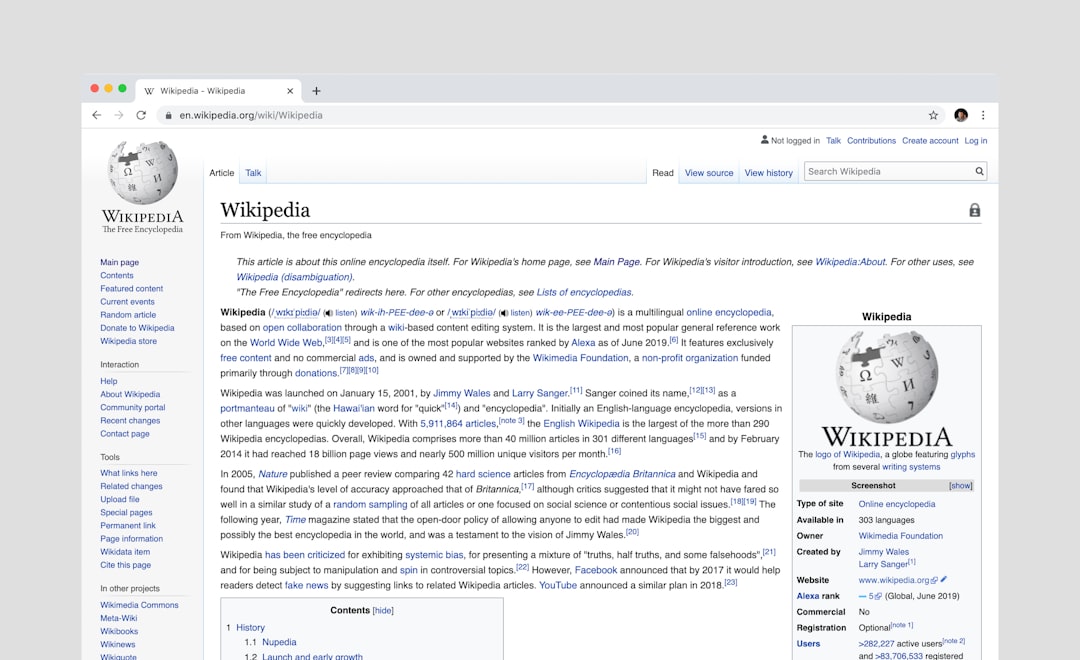 Wikipedia article page open in a browser, showing the Wikipedia logo, navigation sidebar, and content text titled ‘Wikipedia’ on a light gray background.