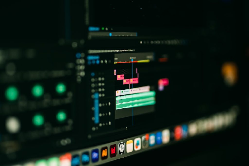 a close up of a computer screen with a blurry background ai generated images content creation workflow multimedia automation - AI Bud Video editing timeline with colorful tracks on a dark monitor, editing software in use.