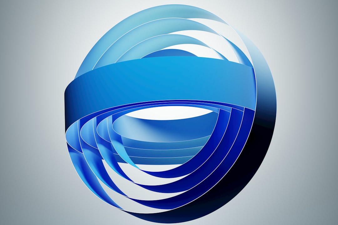 Abstract blue spherical sculpture formed by overlapping curved ribbons.