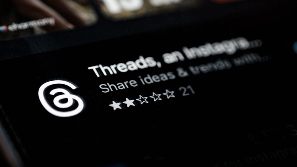 Logo for Threads app with the text 'Threads, an ...' and the subtitle 'Share ideas & thoughts with...' plus a 5-star rating showing two filled stars and three outlines.