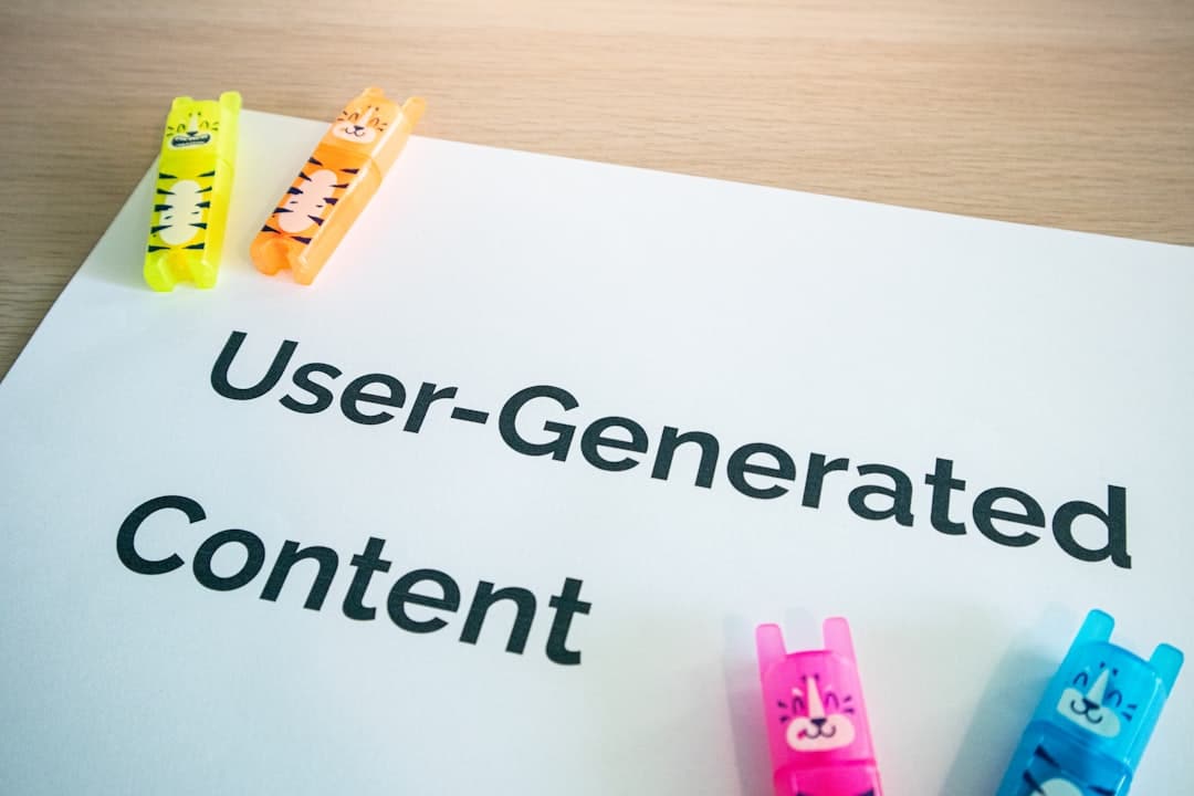 White sheet with the text 'User-Generated Content' and colorful tiger-themed highlighters clipped along its edges (yellow, orange, pink, blue).