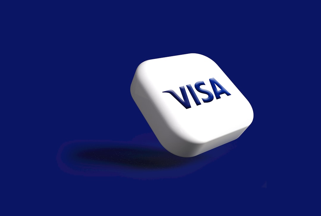 3D white keycap with the VISA logo on a blue background, suggesting payment or card use