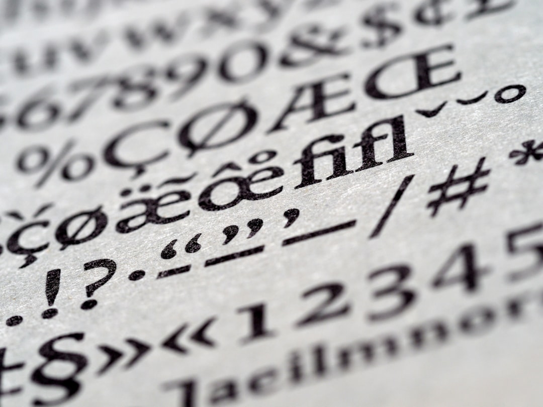 Close-up of printed text and punctuation on white paper (macro photography).