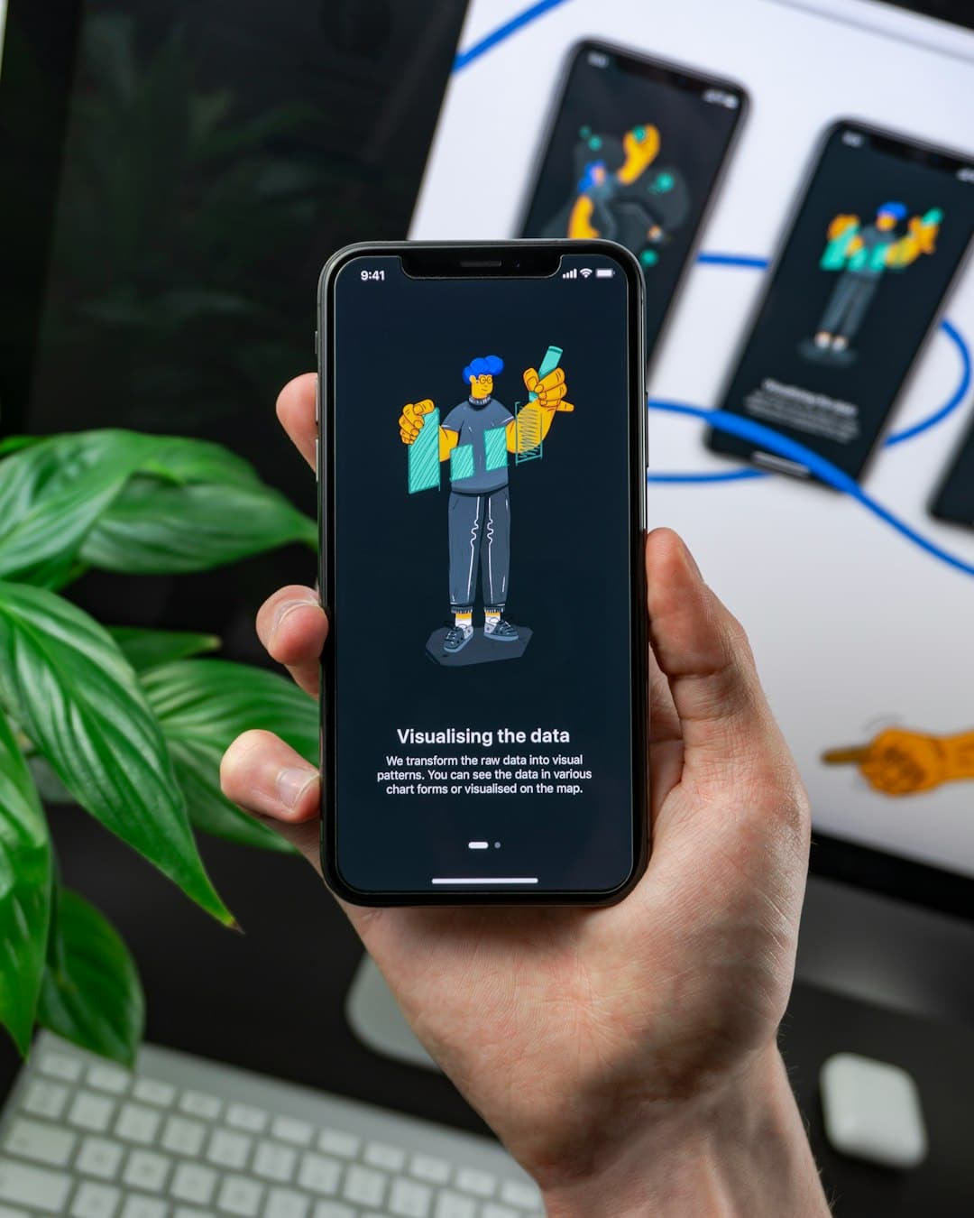 turned on smartphone digital workspace templates productivity dashboard - AI Bud Hand holding a smartphone showing an illustration of a person with charts and the caption'Visualising the data'.