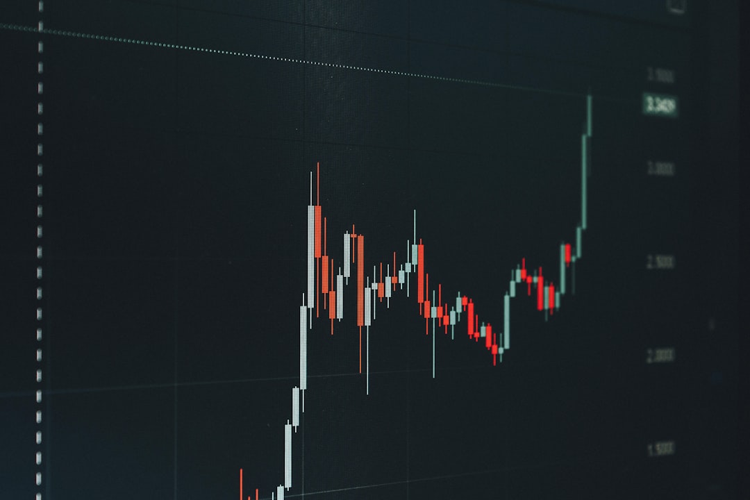 Candlestick chart showing upward stock price trend with white and red bars on a dark grid background