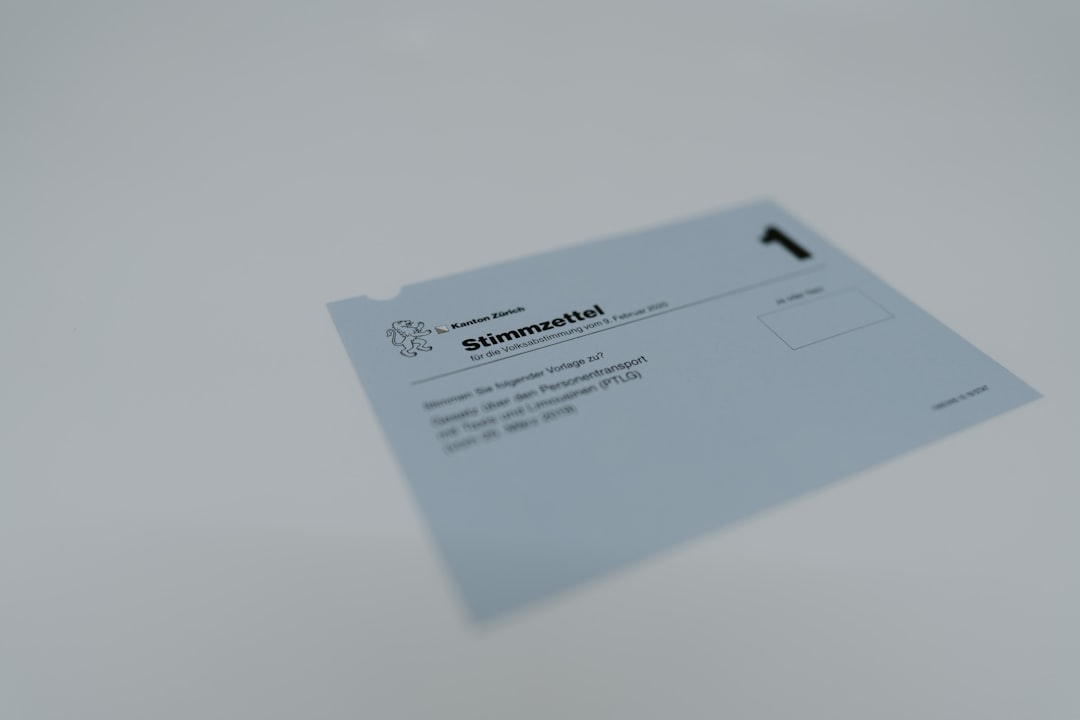Blue Swiss ballot paper with cantonal logo, titled 'Stimmzettel', showing space for vote on a referendum