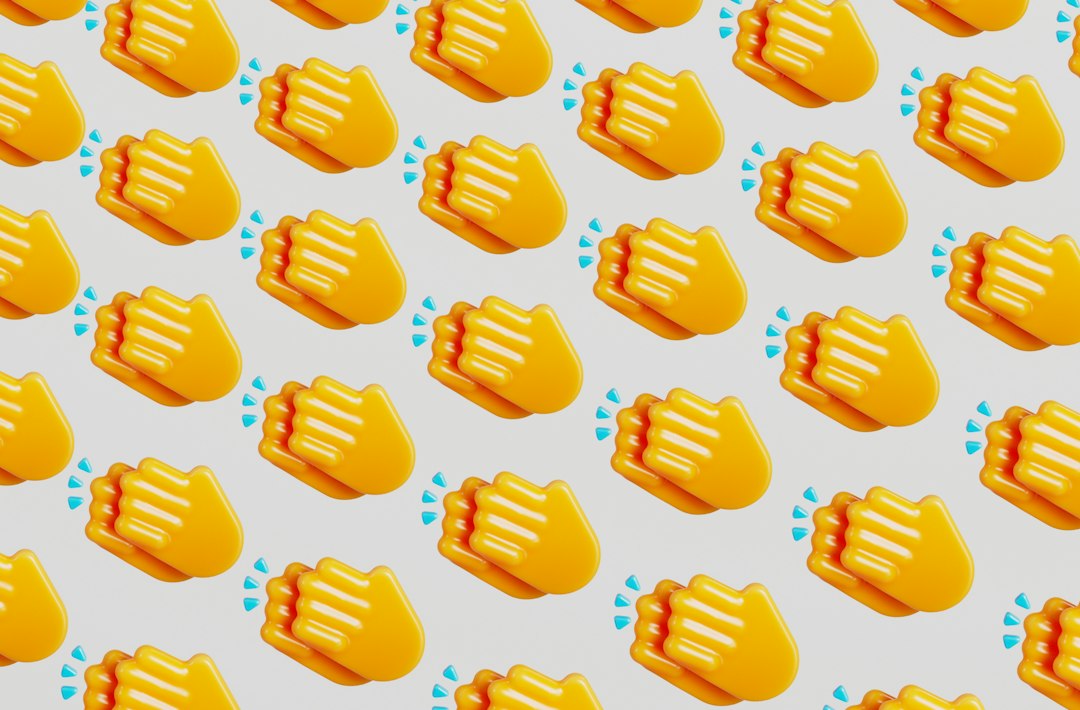 Repeated pattern of yellow clapping hands emojis on a light background, conveying celebration.