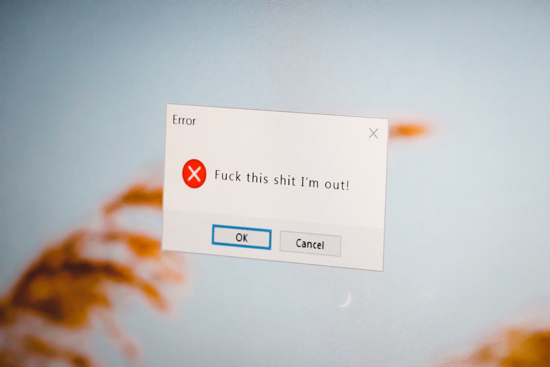 Error dialog with a red X icon showing the message: 'Fuck this shit I'm out!' and buttons 'OK' and 'Cancel' on a pale blue background.