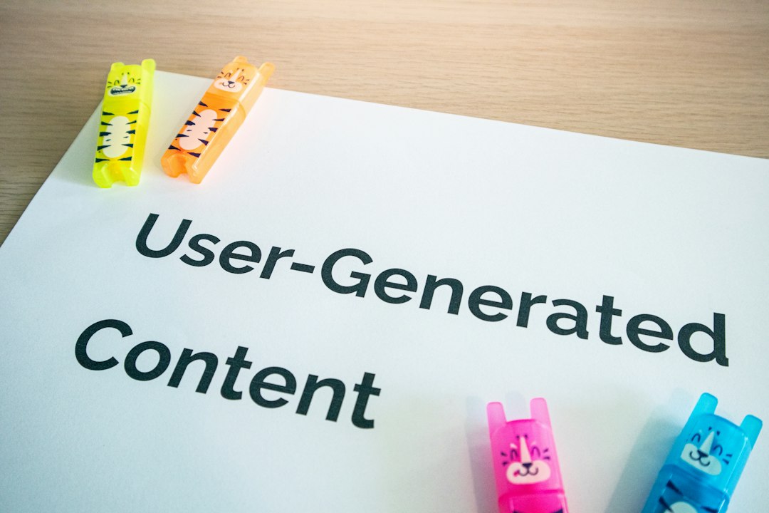 Close-up of a white sheet with 'User-Generated Content' in bold black letters, surrounded by colorful animal-shaped highlighters.