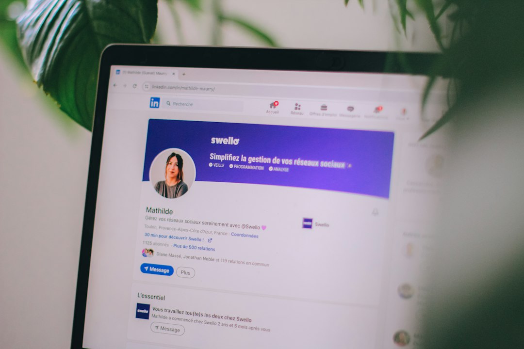 Laptop screen displaying a LinkedIn profile for Mathilde with a circular avatar and a purple Swello banner in the header.