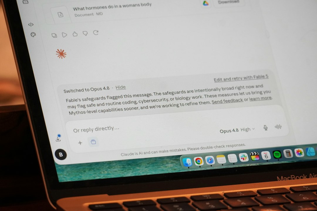 Screenshot of a laptop screen showing a chat interface with a message about safeguards and a bottom dock of apps on macOS.