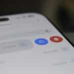Close-up of a smartphone screen displaying a control panel with a blue timer button and a red delete button.