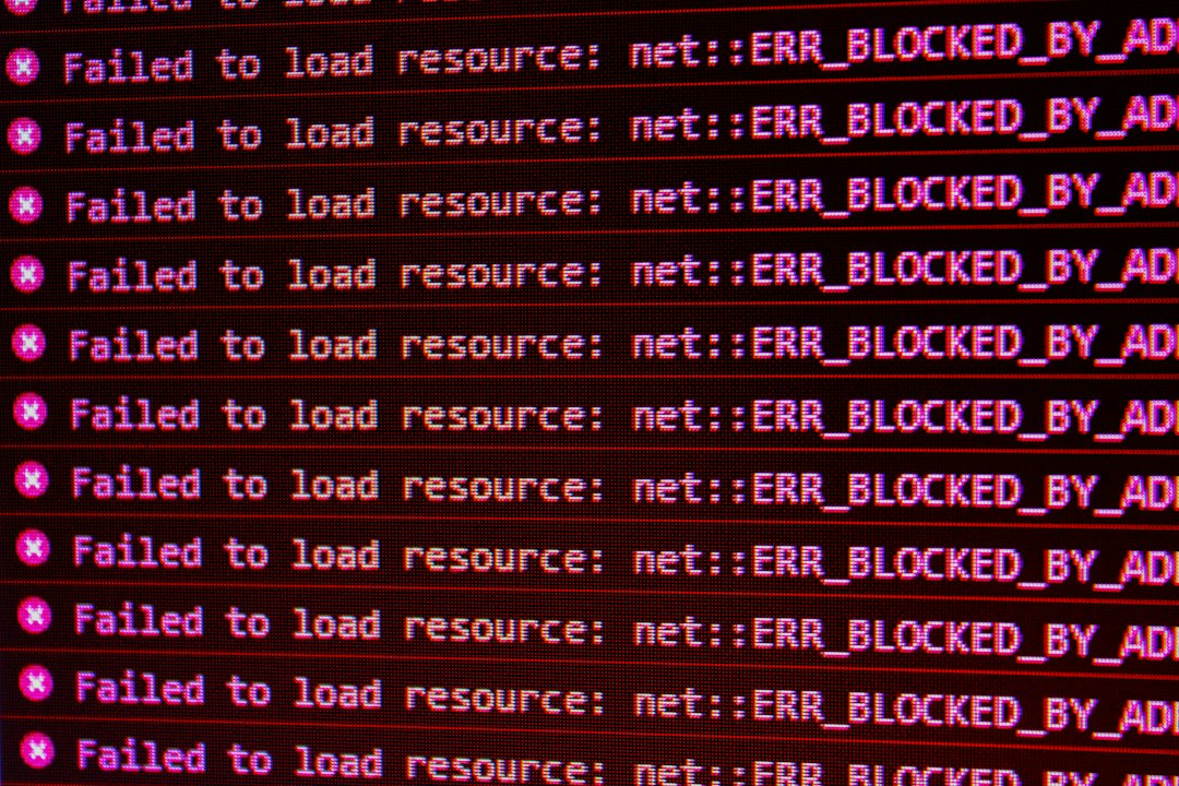 Error messages in red text: 'Failed to load resource: net::ERR_BLOCKED_BY_AD' repeated across the screen (ad blocker blocked resources)