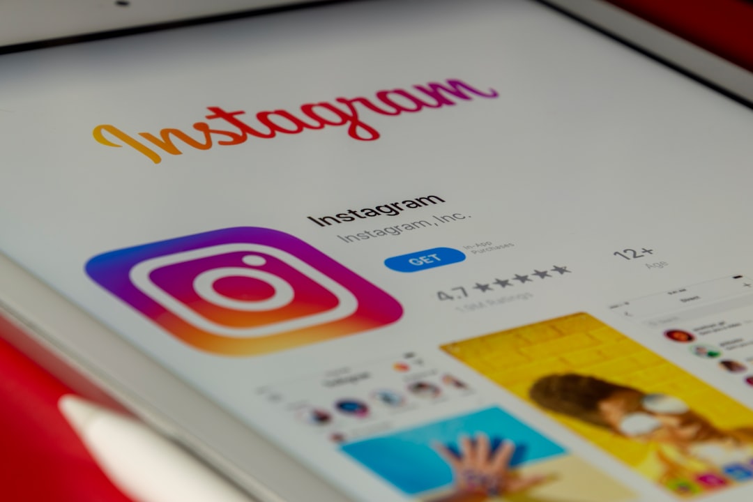 Close-up of a tablet displaying Instagram's app page, featuring the colorful Instagram logo and the 'Instagram' heading.