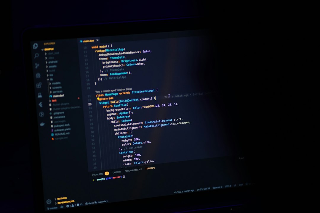 Dark monitor showing a code editor with Dart/Flutter code and colorful syntax highlighting.