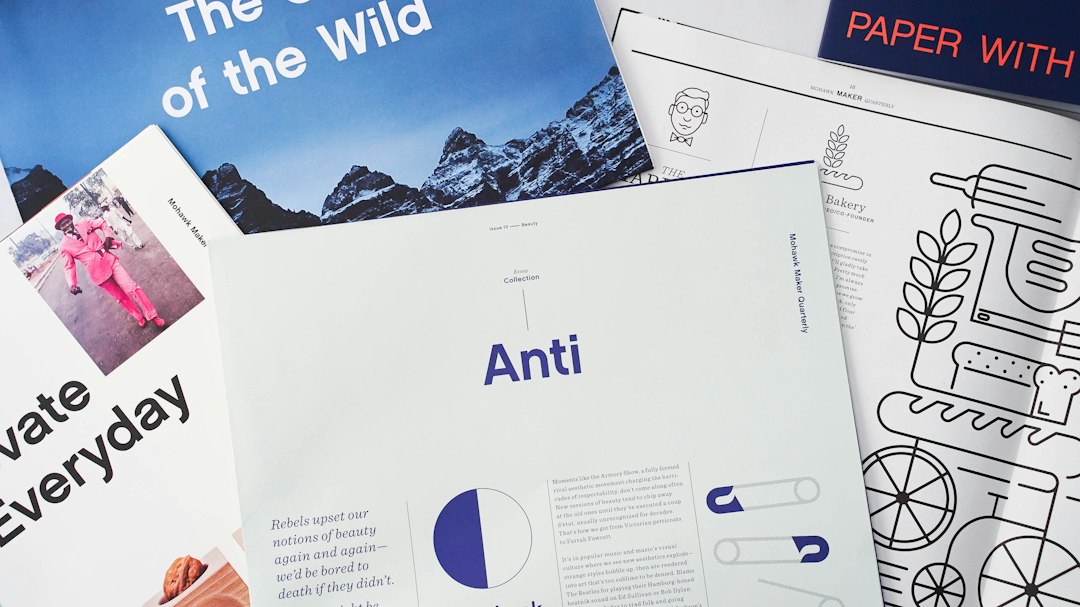 Collage of magazines and print layouts, with a central page titled 'Anti' in purple and blue accents.
