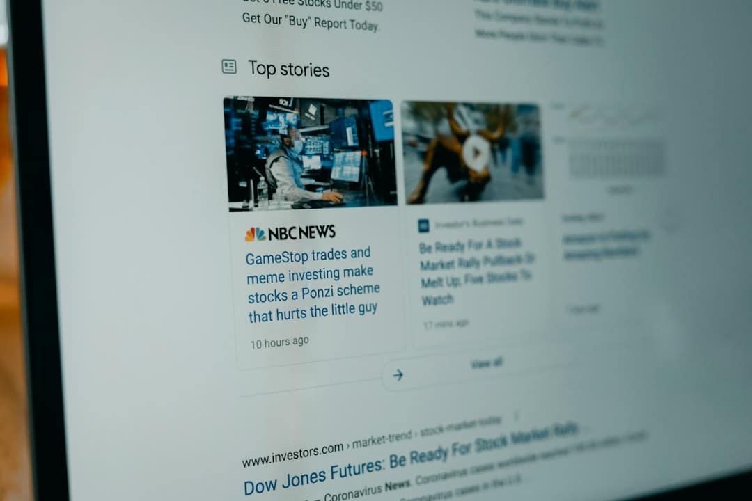 News feed on a laptop screen showing 'Top stories' with two article cards, including an NBC News story about GameStop and stocks.
